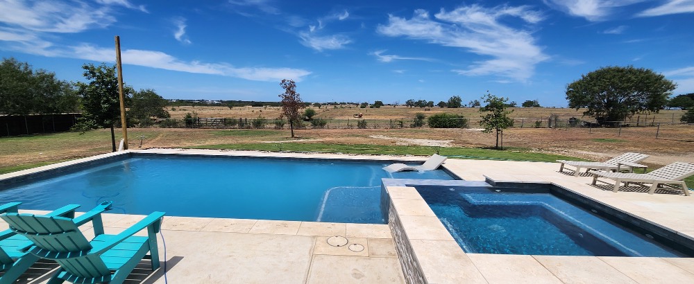 Custom waterfall pool built by J. Oliver Pools in New Braunfels, Texas