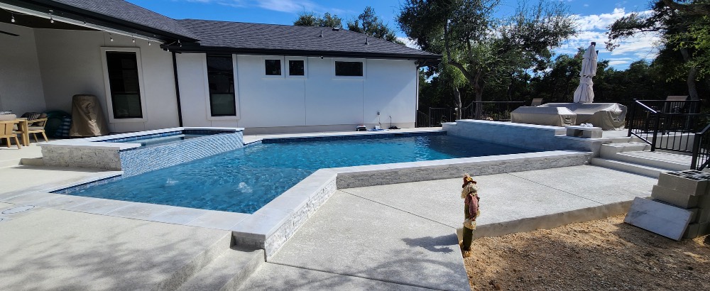 Custom pool with raised spa built near Boerne, Texas